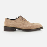 The DI BIANCO Nettuno Suede Lace Up Loafer is shown in beige suede with decorative perforations, Norwegian welting, a lace-up front, and a dark brown sole, presented in a side view against a plain white background.