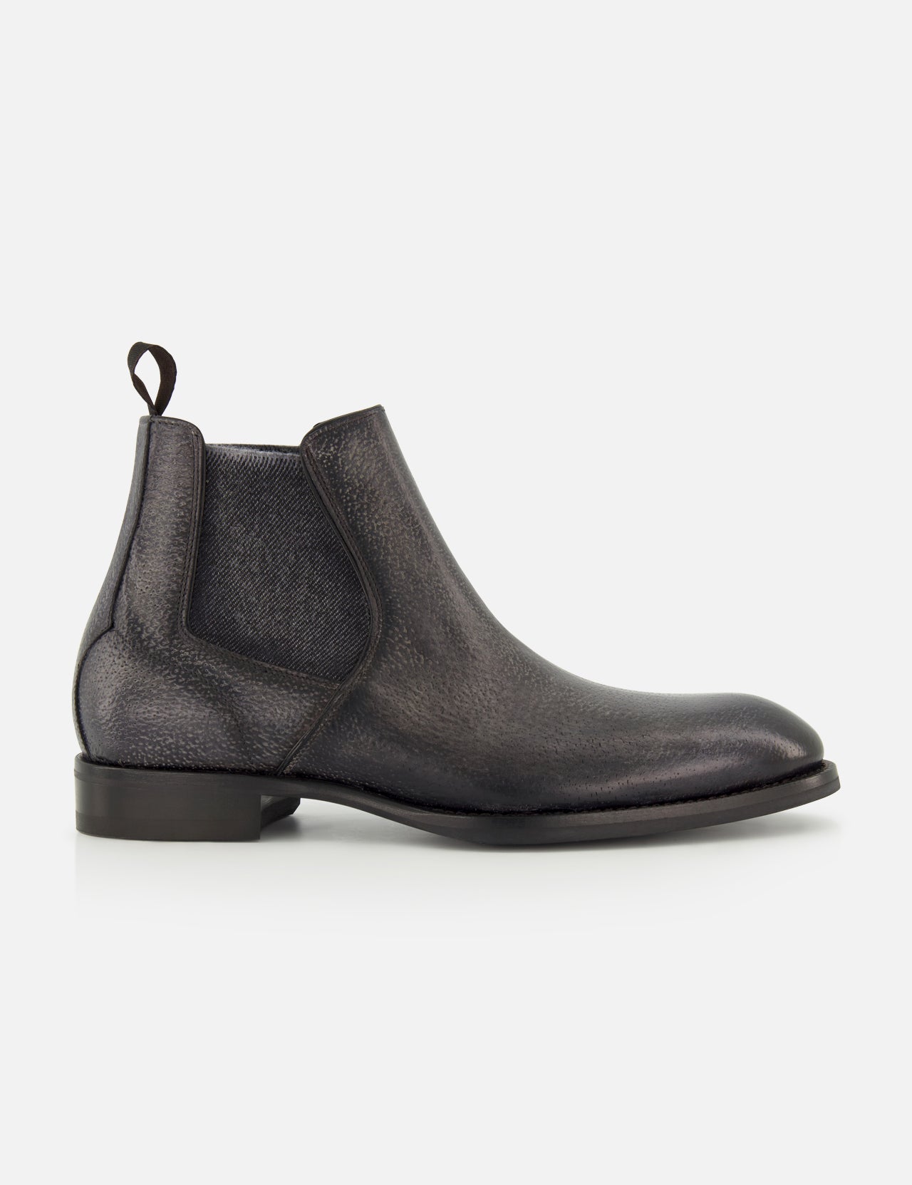 The Osimo Peccary Boot by DI BIANCO is a black leather Chelsea boot featuring elastic side panels, a pull tab, low stacked heel, and rounded toe, shown in a side profile on a plain white background.