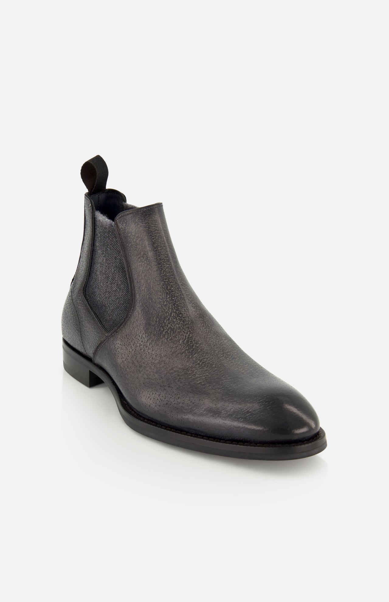 The Osimo Peccary Boot by DI BIANCO is a dark gray grained leather Chelsea boot with a subtle shine, elastic side panels, and a fabric pull tab at the back, shown on a white background.