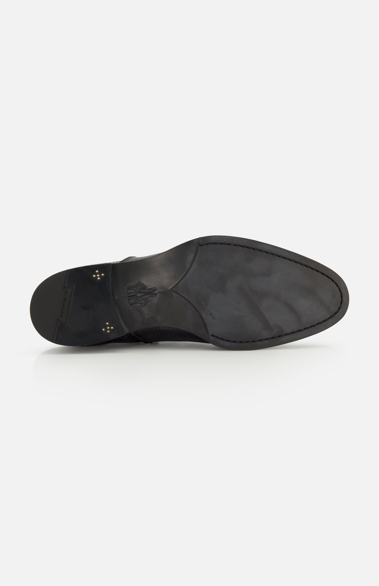The image displays the black sole of the Osimo Peccary Boot by DI BIANCO, crafted from grained leather. Viewed from below on a white background, it features a stamped logo near the heel and has a smooth, minimal tread.