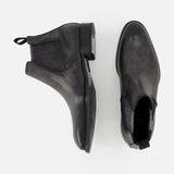 A pair of Osimo Peccary Boot by DI BIANCO in black grained leather, shown from the side and top views against a white background.