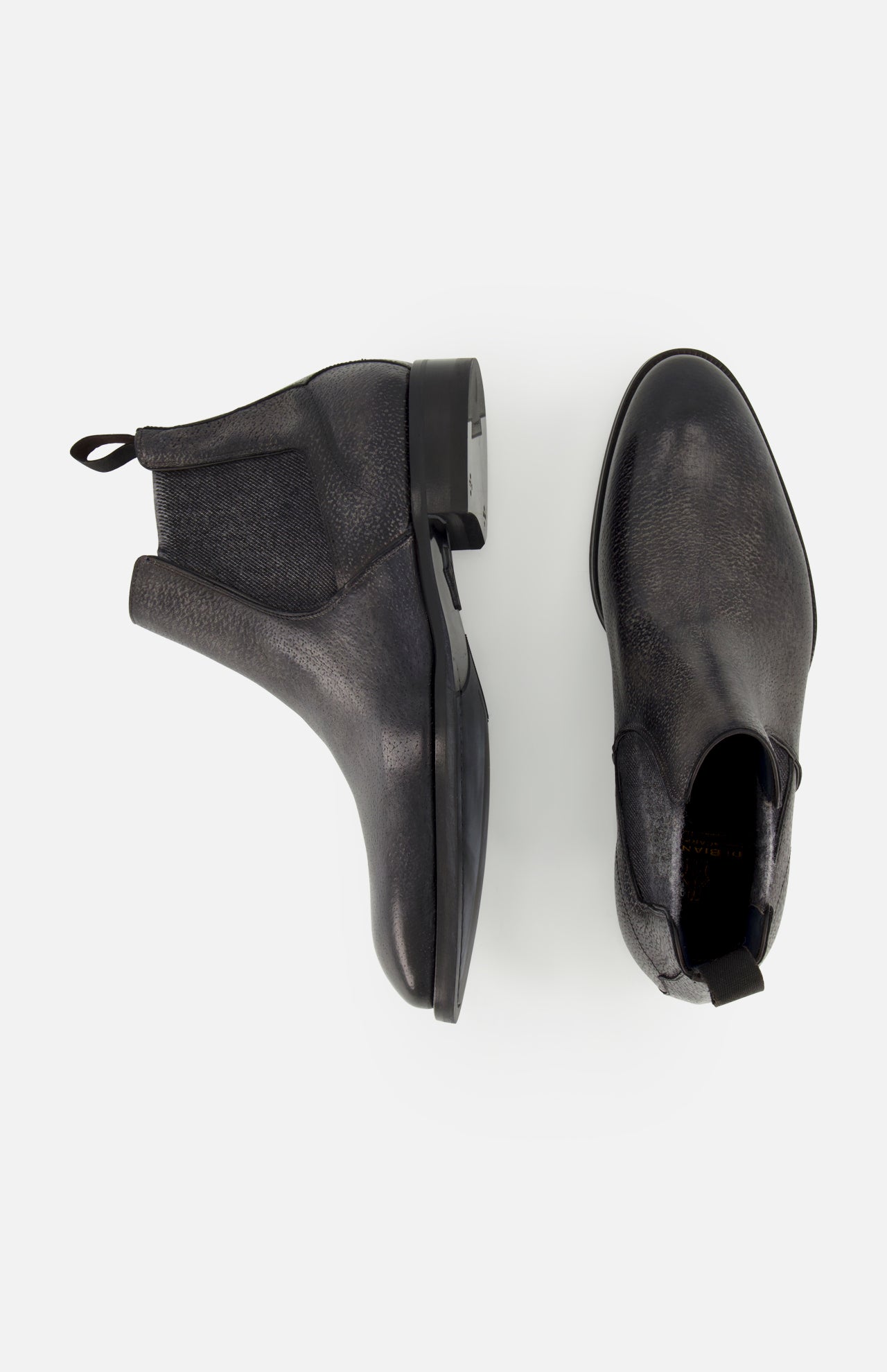 A pair of Osimo Peccary Boot by DI BIANCO in black grained leather, shown from the side and top views against a white background.