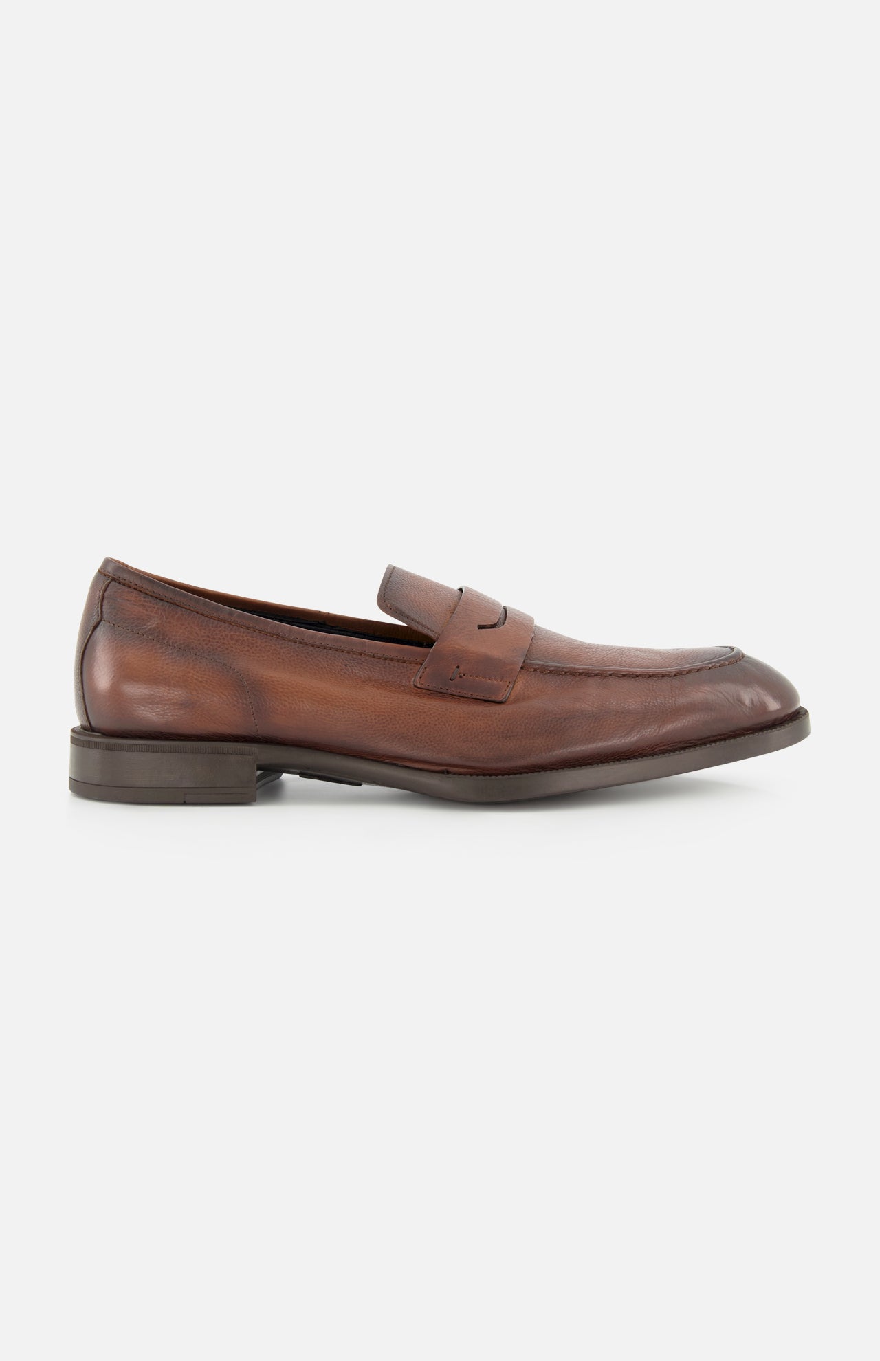 The DI BIANCO Tombolo California Slip On Loafer, shown in side profile against a white background, features brown leather, a low heel, visible stitching, and a penny slot detail. This classic loafer is expertly crafted in Italy.
