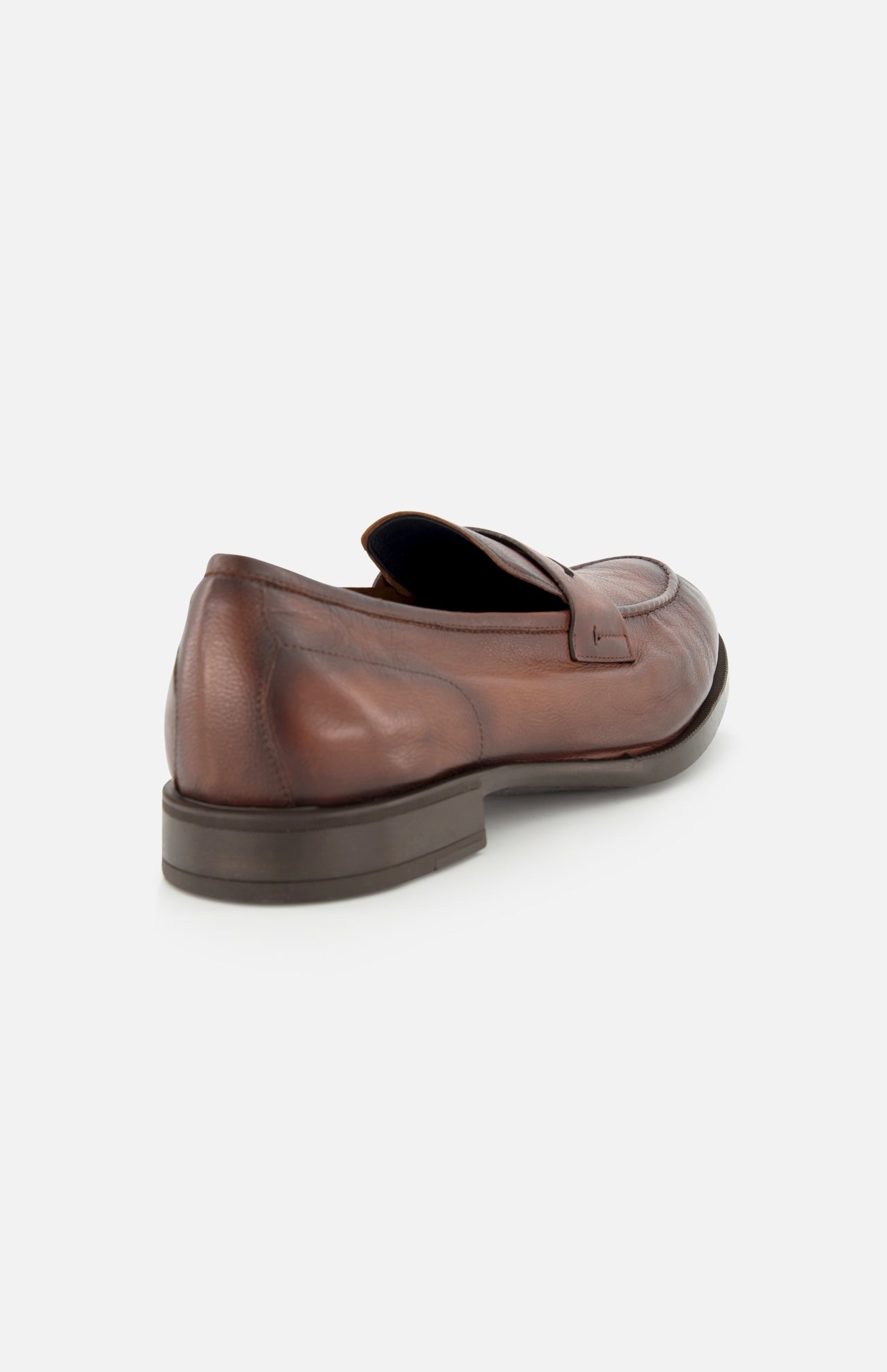 The DI BIANCO Tombolo California Slip On Loafer is displayed from the back at an angle on a white background, showcasing its brown leather, penny strap, and visible stitching details. Made in Italy.