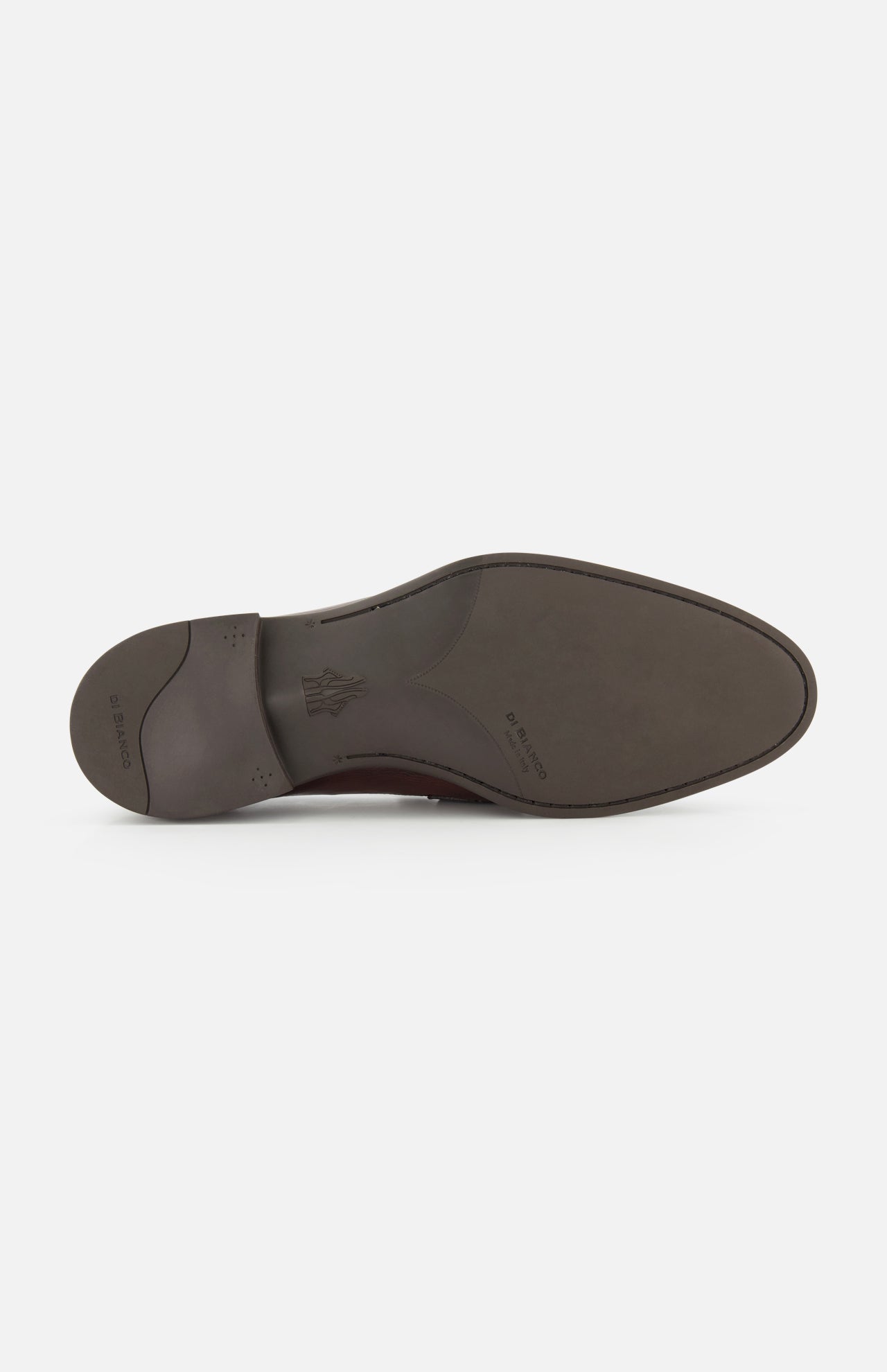The image displays the sole of the DI BIANCO Tombolo California Slip On Loafer, crafted in smooth dark brown leather with a slight heel. The sole features a stamped logo, printed text near the arch, and "Made in Italy" proudly inscribed.