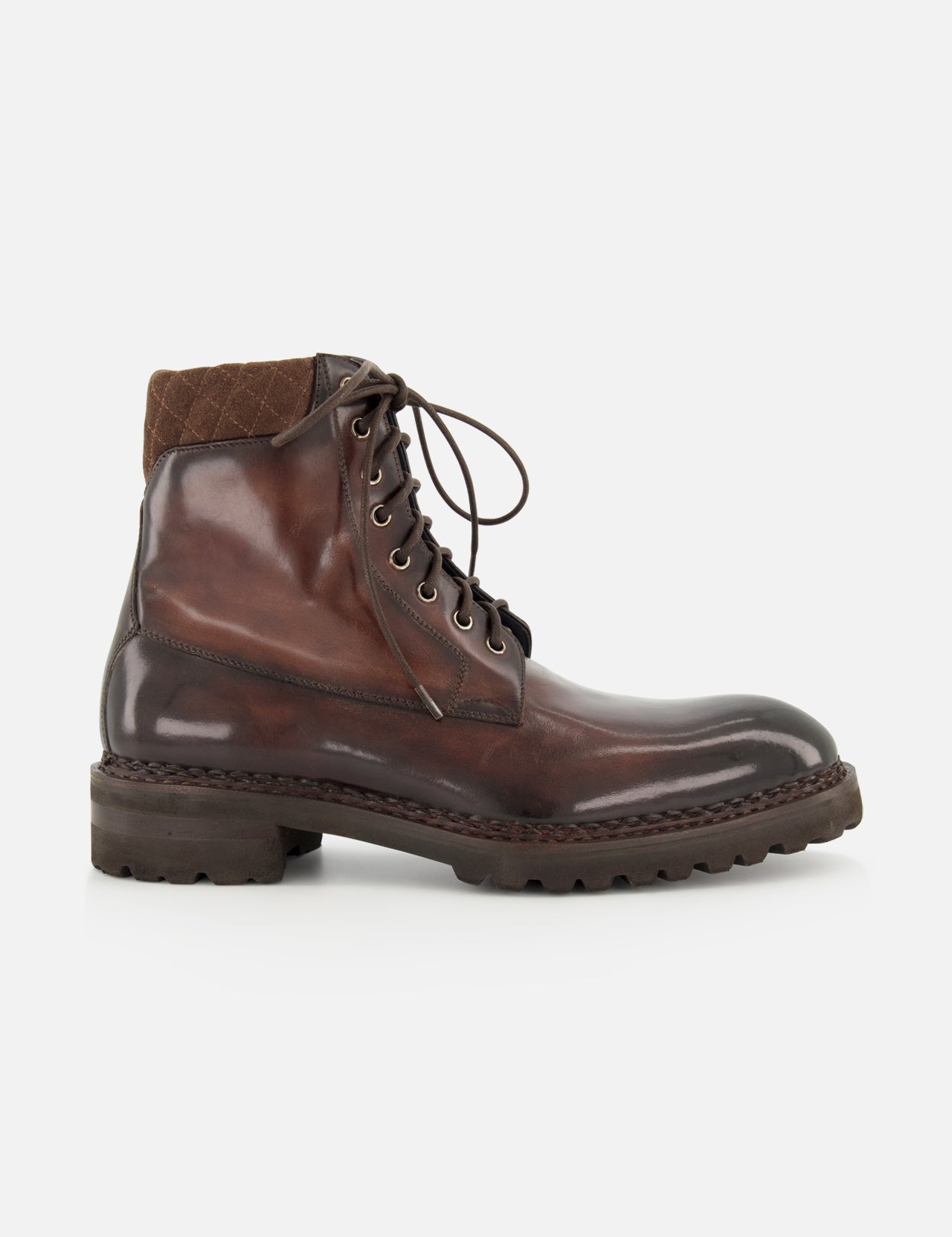 The DI BIANCO Torino Calfskin Suede Boot is shown in profile on a plain white background—a single, dark brown military-style boot, handmade in Italy, featuring a thick rubber sole, quilted fabric around the ankle, and detailed stitching.