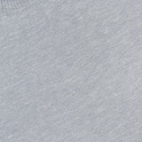 Close-up of the Libeccio Wren Crewneck Sweater in light gray, featuring a ribbed collar and expertly crafted from a luxurious blend of wool, silk, and linen. A white label with black text reading “ELDER STATESMAN” is partially visible at the neckline, highlighting the refined craftsmanship associated with this premium knitwear brand.