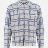ELDER STATESMAN Nimbus Plaid Button Up Knit Overshirt in light gray with a blue checkered pattern, featuring long sleeves, a collar, and a single chest pocket, displayed against a white background.