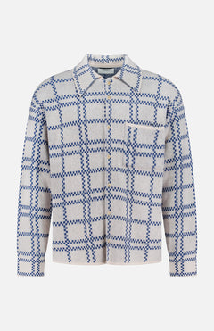 ELDER STATESMAN Nimbus Plaid Button Up Knit Overshirt in light gray with a blue checkered pattern, featuring long sleeves, a collar, and a single chest pocket, displayed against a white background.