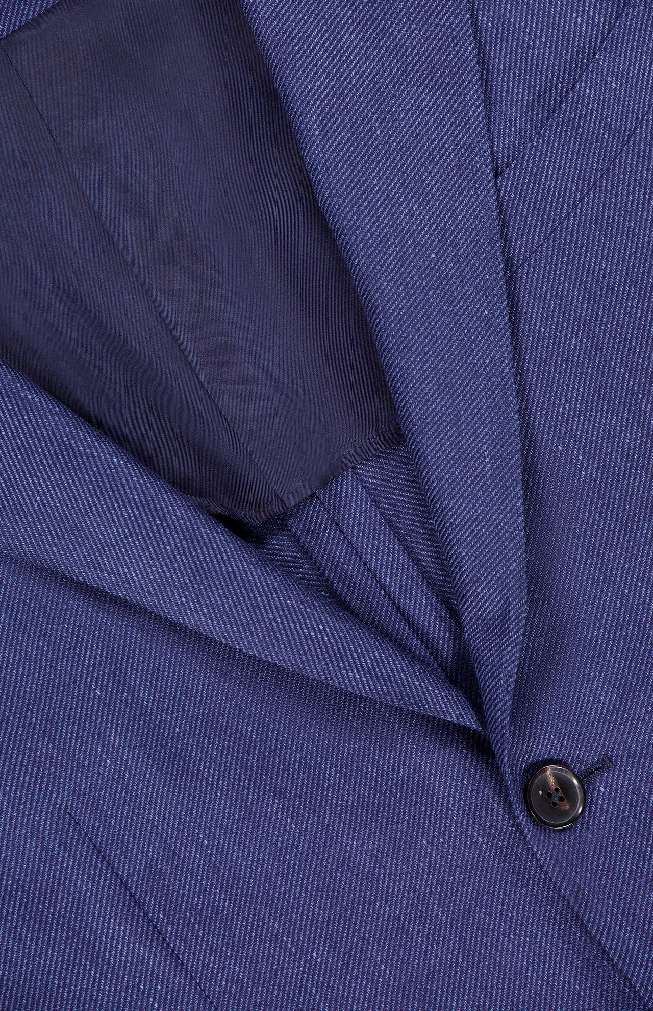 Close-up of the ZEGNA Cashmere Silk Linen Sportcoat in dark blue, made in Italy. The image highlights the button, lapel, inner lining, and showcases the detailed fabric texture and fine stitching.