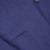 Close-up of the ZEGNA Cashmere Silk Linen Sportcoat in dark blue, made in Italy. The image highlights the lapel, a single black button, part of a pocket, and displays the fabric’s fine stripes and textured weave.