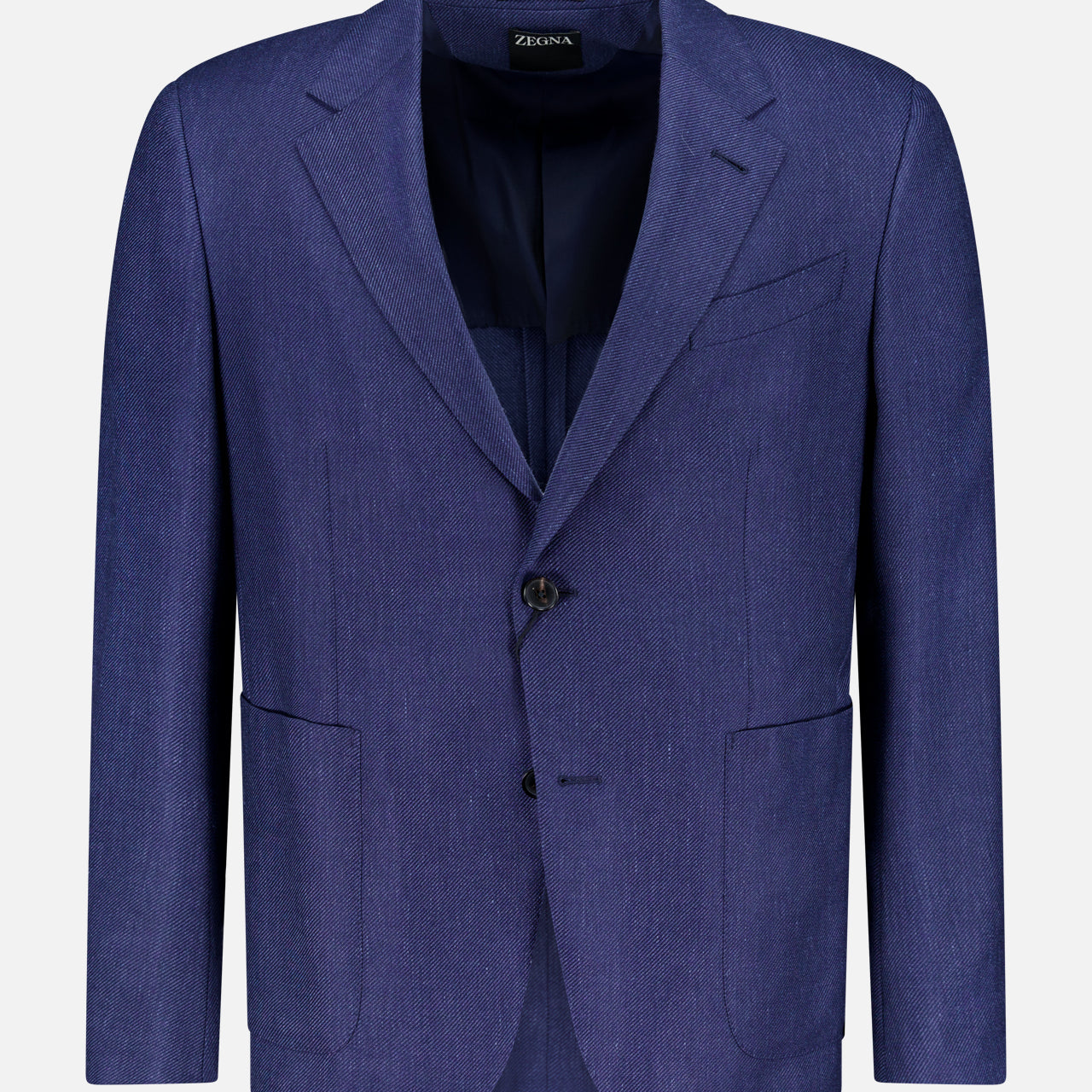 The ZEGNA Cashmere Silk Linen Sportcoat is a dark blue, single-breasted two-button jacket with notched lapels, front patch pockets, and a chest pocket. Made in Italy from a luxurious blend, it’s shown against a plain white background.