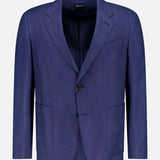 The ZEGNA Cashmere Silk Linen Sportcoat is a dark blue, single-breasted two-button jacket with notched lapels, front patch pockets, and a chest pocket. Made in Italy from a luxurious blend, it’s shown against a plain white background.