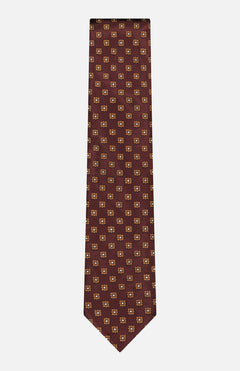 The ZEGNA Floral 100 Fili Tie features an elegant floral pattern, perfect for the modern man. This designer tie is displayed against a white background.