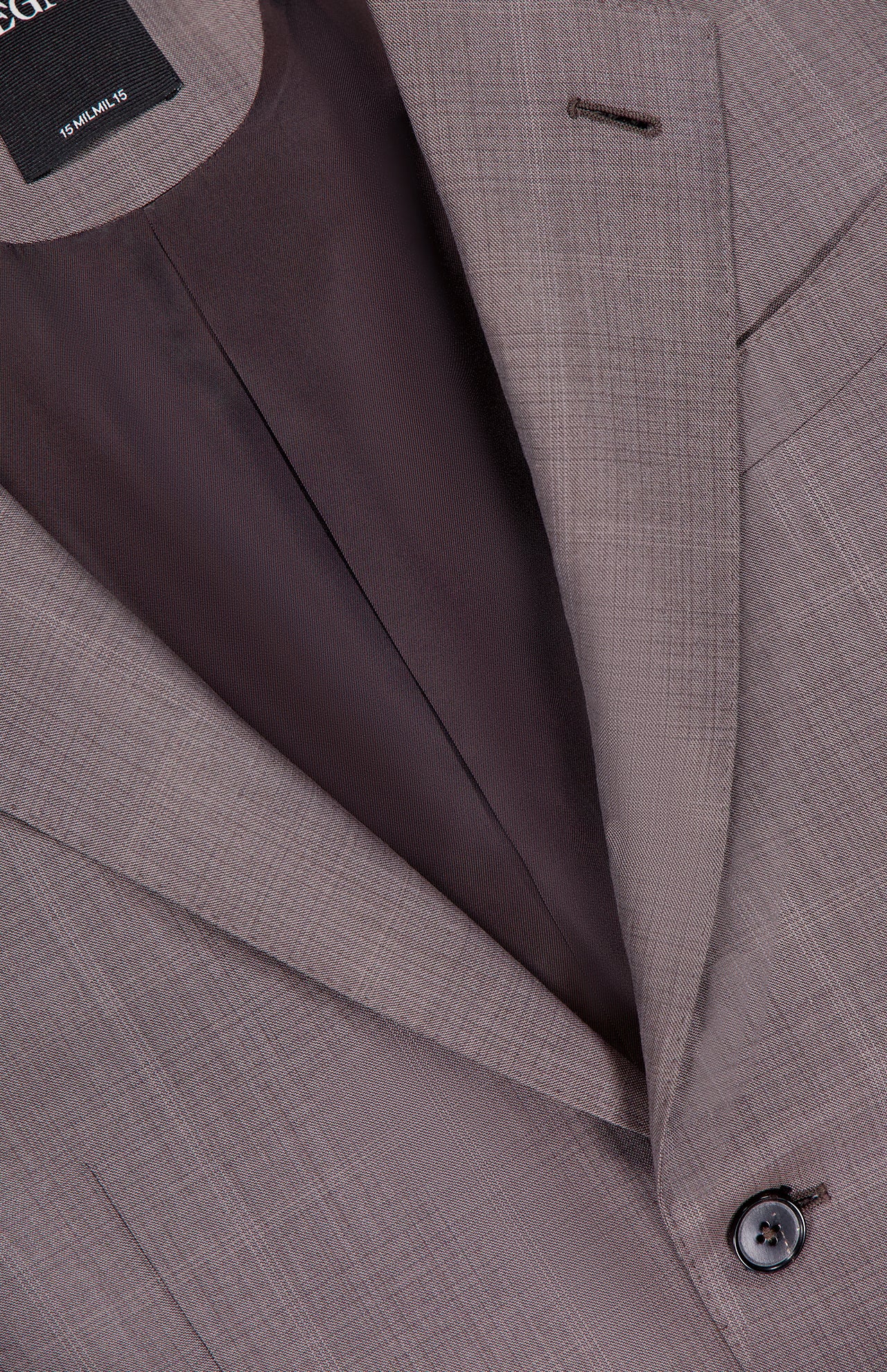 Close-up of the ZEGNA 15MilMil15 Wool Suit jacket in light brown, highlighting the lapel, buttonhole, button, inner lining, and a visible "Made in Italy" label at the top left.