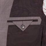 Close-up of the inside pocket of the ZEGNA 15MilMil15 Wool Suit, featuring a gray lining, triangular stitched flap, and single button closure—showcasing expert Italian craftsmanship.