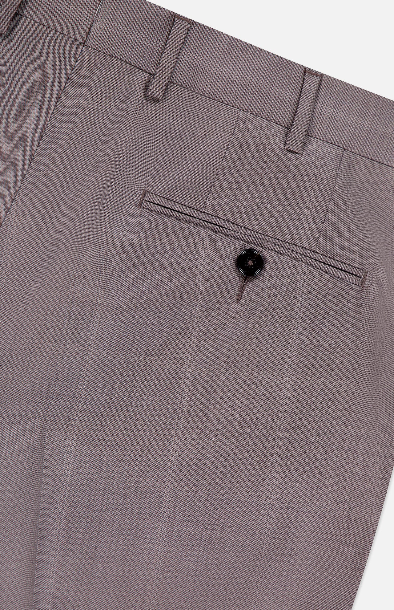 Close-up of the back pocket on the ZEGNA 15MilMil15 Wool Suit, showing a single button closure, belt loops, and subtly textured light brown fabric—crafted for timeless style.
