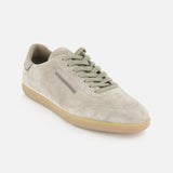 Introducing the ZEGNA 232 Low Top Sneaker: crafted in Italy from beige suede, this elegant footwear features light green laces, a beige rubber sole, and minimal stitching for a refined look. Presented against a white background, the design combines classic inspiration from light grey suede sneakers with modern details, embodying understated sophistication.