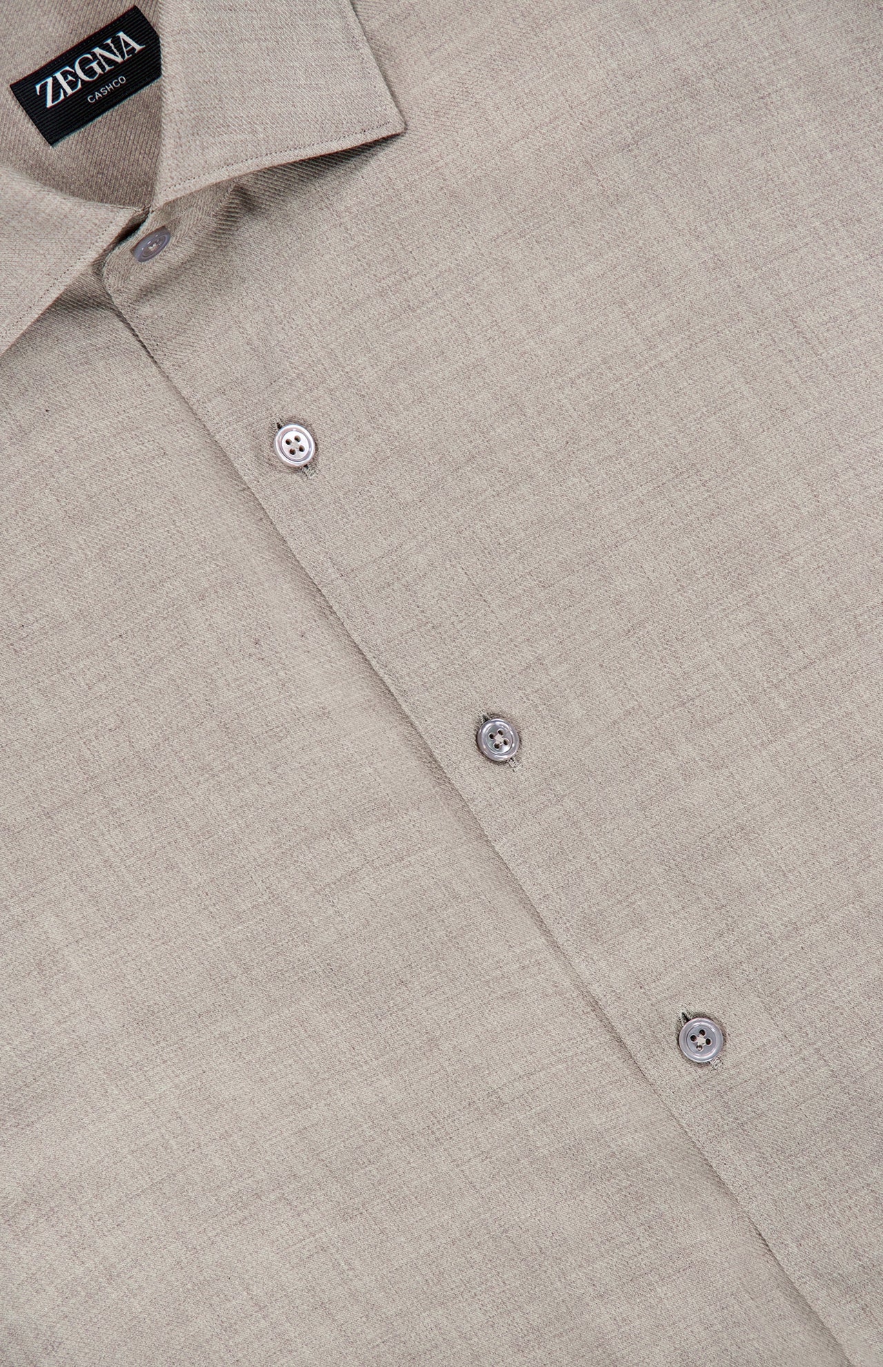 Light beige ZEGNA Cashco Dress Shirt crafted from fine textured fabric, laid flat with three visible grey buttons and a pointed collar.