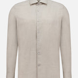 The ZEGNA Cashco Dress Shirt is a long-sleeve, light beige button-up crafted from cashmere cotton with a classic collar, shown against a plain white background.