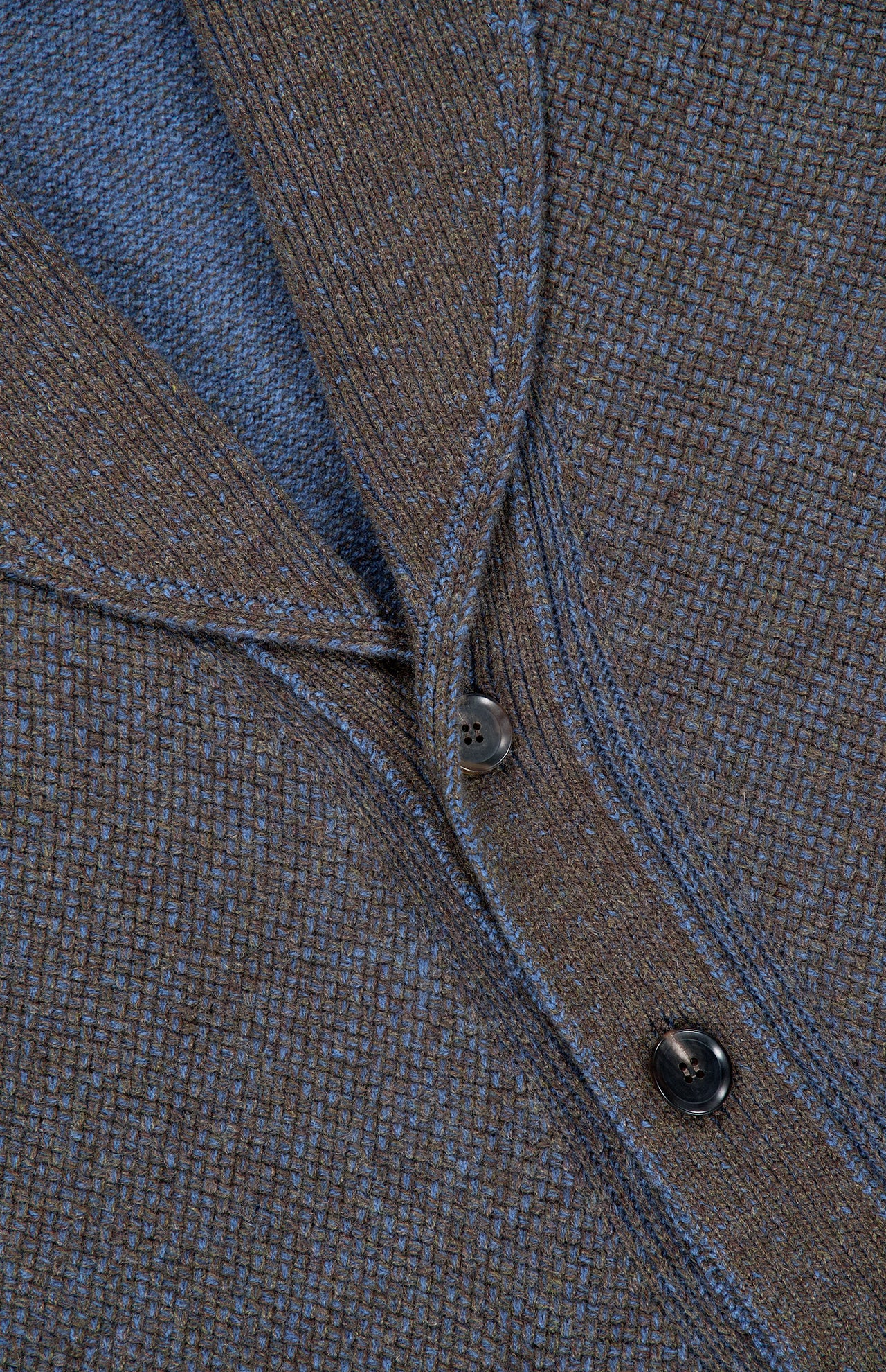 Close-up of the ZEGNA Cashmere & Wool Cardigan Sweater, featuring a textured brown and blue knit with two dark buttons, blue stitching along the seams, and a classic shawl collar.