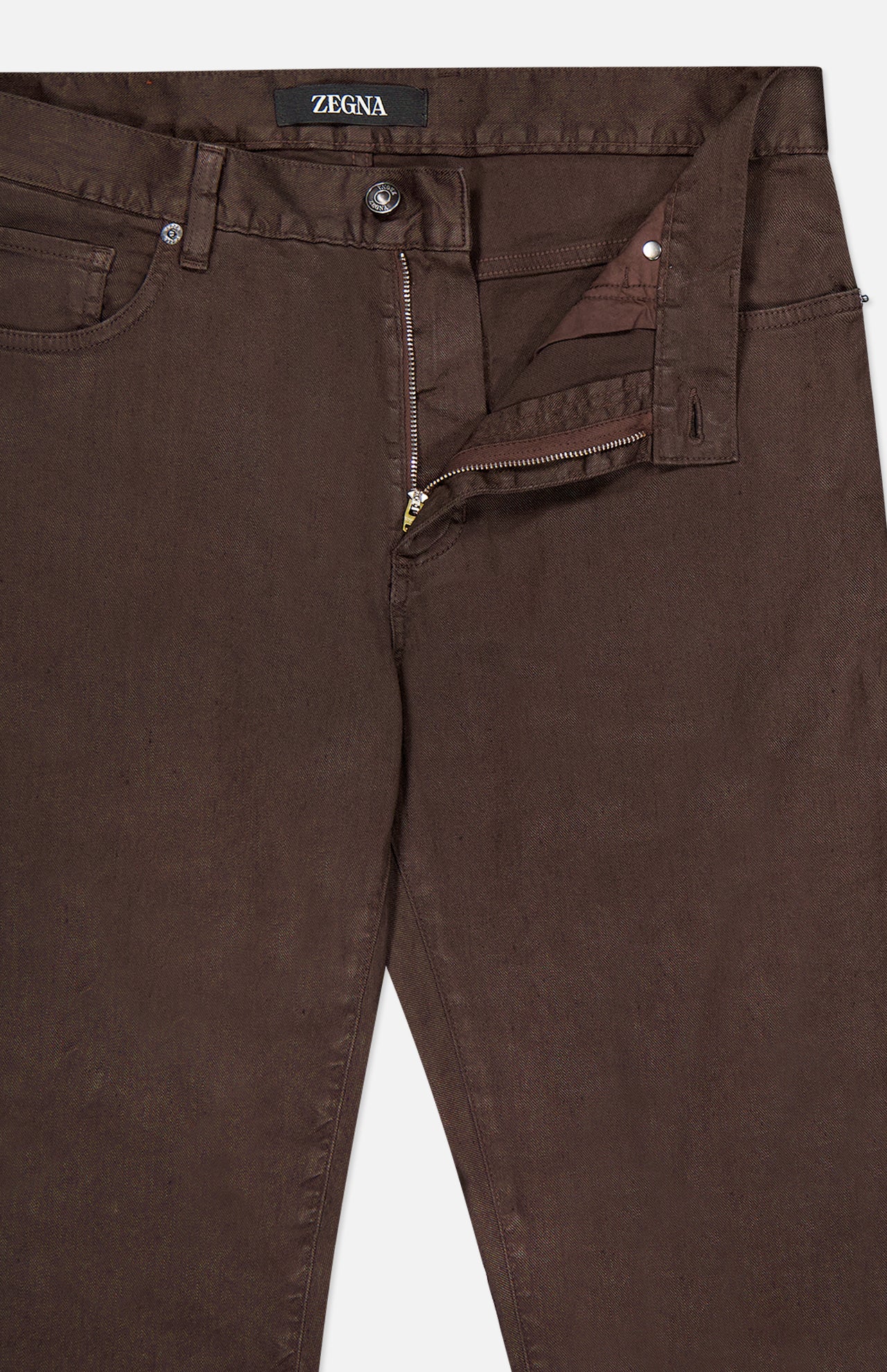 A pair of ZEGNA Comfort Linen Cotton Pants in dark brown, slim fit, shown from the waist down with top button fastened and zipper slightly open, highlighting front pockets and belt loops.