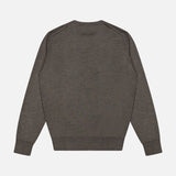 A ZEGNA Crewneck Long Sleeve Shirt in plain dark gray cashmere silk is laid flat, viewed from the back, showcasing its crew neck and ribbed cuffs and hem on a white background. Expertly crafted in Italy, this luxurious shirt features long sleeves and a refined silhouette.