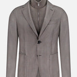The ZEGNA Detachable Knit Bib Sportcoat is a light brown men's luxury blazer with notched lapels, patch pockets, and a built-in zip-up knit bib resembling a mock neck, shown against a plain white background.
