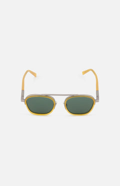 ZEGNA’s Geometric Deep Yellow Sunglasses feature yellow acetate and metal frames, green oval lenses, and a sleek silver bridge and arms—designer eyewear that pops against a white background.