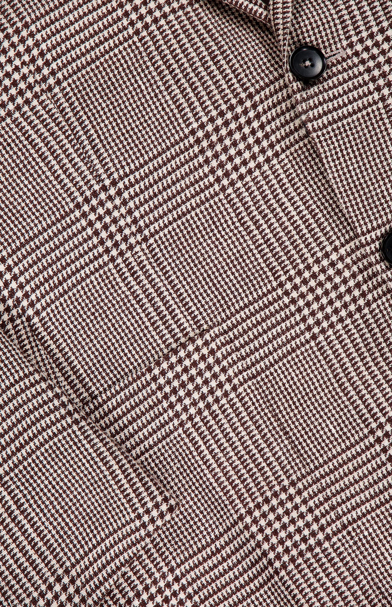 Close-up of the ZEGNA Houndstooth Plaid Linen-blend Sportcoat, showcasing a brown and beige glen check pattern with intersecting lines, small checks, and two visible dark buttons—ideal for a men's professional wardrobe.