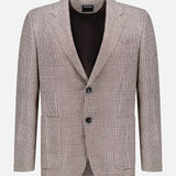 The ZEGNA Houndstooth Plaid Linen-blend Sportcoat features a black and white pattern, single-breasted design, notched lapels, two front buttons, and flap pockets—an ideal choice to elevate any men's professional wardrobe. Displayed on a plain white background.