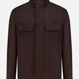 The ZEGNA Microfiber Polyester Twill Field Jacket features a dark brown shade, long sleeves, stand collar, concealed button placket, flap chest pockets, and simple cuffs. Shown front-facing on a white background—ideal men's outerwear for any occasion.