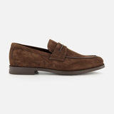 Introducing the Mocassin Loafer with Band by ZEGNA—a men’s loafer crafted from sumptuous brown Italian suede. This classic shoe features a low heel, rounded toe, and a signature decorative band across the top. Photographed in profile on a white background, it embodies timeless design and refined Italian craftsmanship. Made in Italy.
