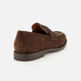 A single ZEGNA Mocassin Loafer with Band is displayed at a rear angle against a plain white background, highlighting its smooth Italian suede texture, low heel, and classic penny strap. This men’s moccasin reflects ZEGNA’s commitment to timeless craftsmanship and sophistication.