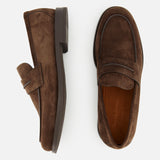 Top and side view of ZEGNA’s Mocassin Loafer with Band in brown Italian suede, featuring visible stitching and a low heel, displayed on a white background; these men’s loafers exemplify classic elegance and quality craftsmanship, Made in Italy.