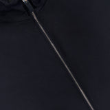 Close-up of the ZEGNA Motorin 2-way Zip Jacket in a dark minimalist design, featuring a silver zipper partially unzipped to reveal the ZEGNA label inside the collar.