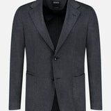 The Oasi Cashmere Beaver Jacket by ZEGNA is a charcoal gray men’s blazer, masterfully crafted in Italy. It showcases two buttons, notched lapels, and front patch pockets—an elegant addition to luxury menswear, displayed on a plain white background.