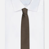 A neatly folded white dress shirt is paired with the ZEGNA Oasi Cashmere Jacquard Tie, crafted in Italy, and displayed against a plain white background.