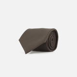The ZEGNA Oasi Cashmere Jacquard Tie, crafted in Italy from luxurious cashmere, is elegantly rolled and displayed against a clean white background.