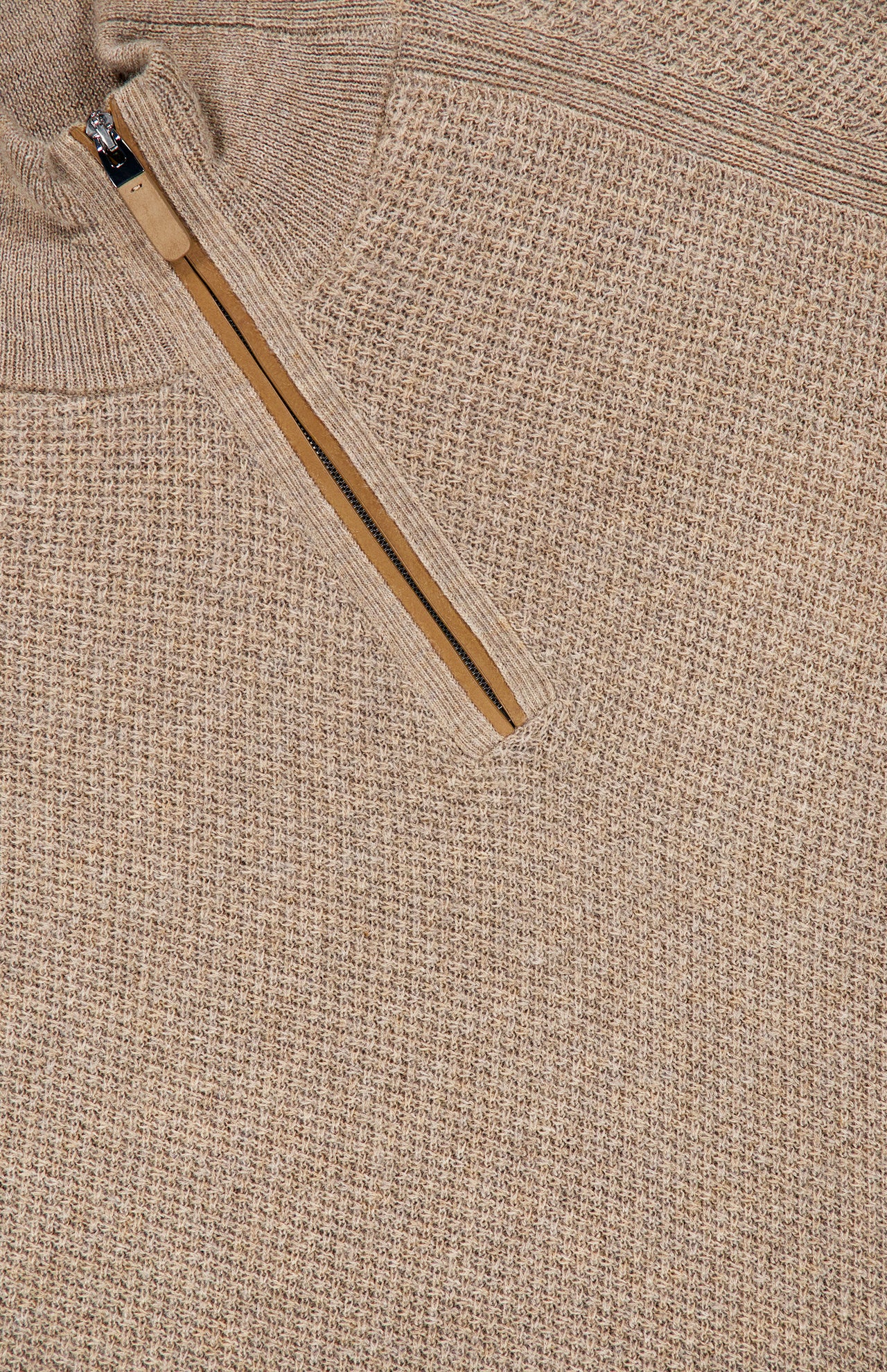 Close-up of the ZEGNA Oasi Cashmere Zip Mockneck Sweater in beige Italian cashmere, featuring a textured knit pattern and a partially unzipped tan zipper at the mock neck collar.