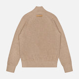 The Oasi Cashmere Zip Mockneck Sweater by ZEGNA is shown from the back in beige, crafted from Italian cashmere. It features a ribbed collar, cuffs, and hem, with a small tan rectangular label near the neckline. Presented against a plain background.