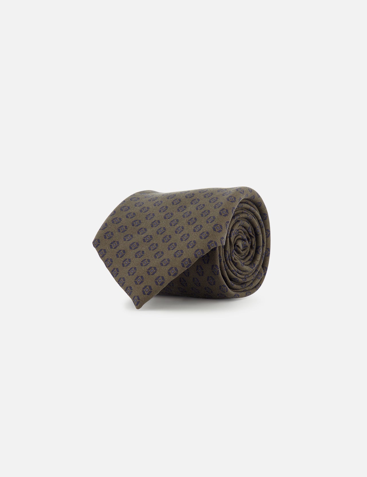 The ZEGNA Geometric Pattern Silk Tie features a dark green rolled-up design with subtle navy blue geometric motifs, crafted from silk and showcased on a plain white background.