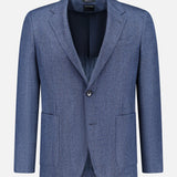 ZEGNA Pure Cashmere Sportcoat in blue herringbone, featuring notched lapels, front button closure, two lower patch pockets, and a chest pocket, presented against a white background—an elegant choice for refined occasions.