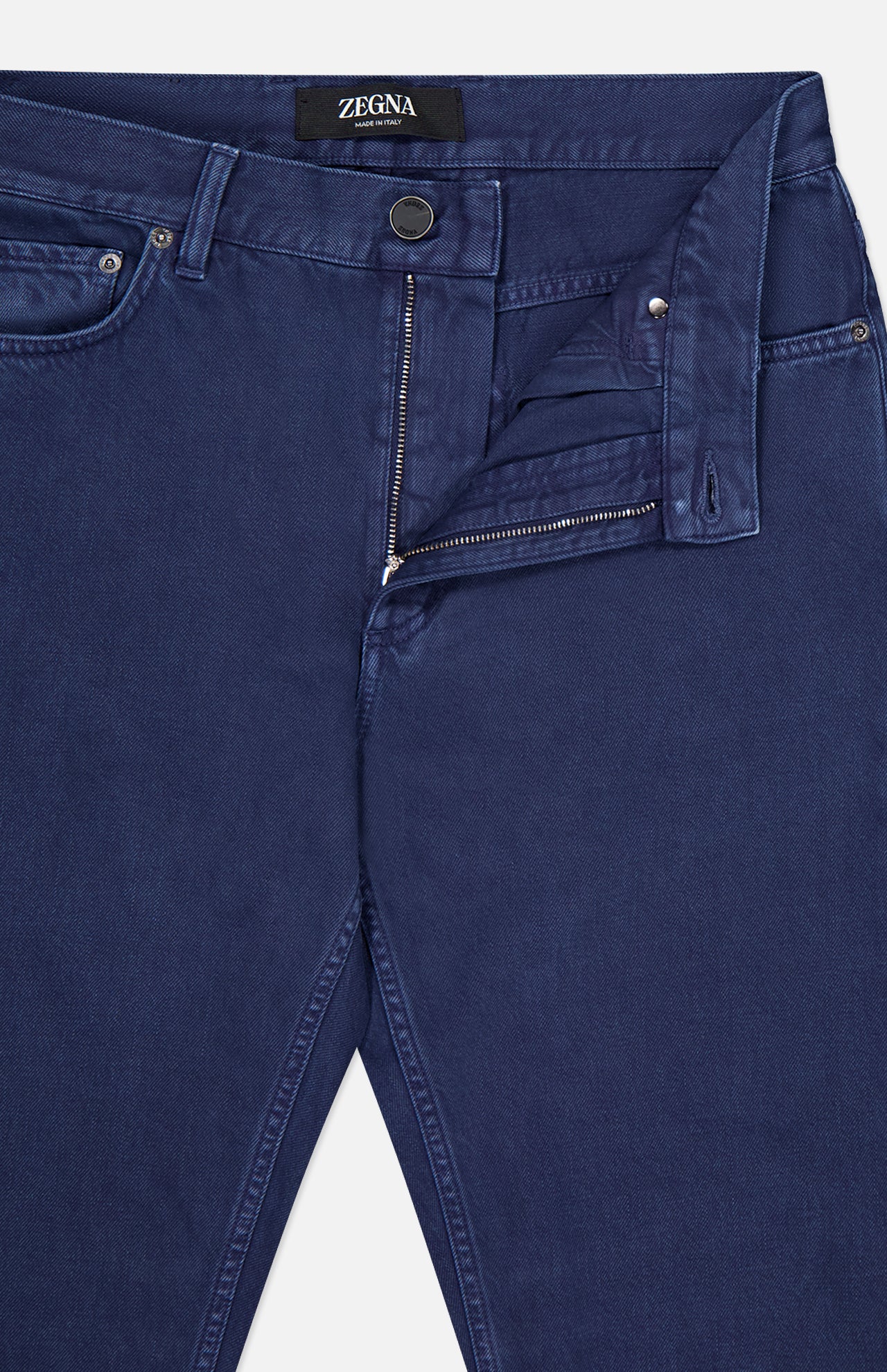 A pair of ZEGNA Pure Cotton Slim Fit Pants in dark blue, shown with the waistband and zipper partially open to reveal the inside pocket and button fly details.