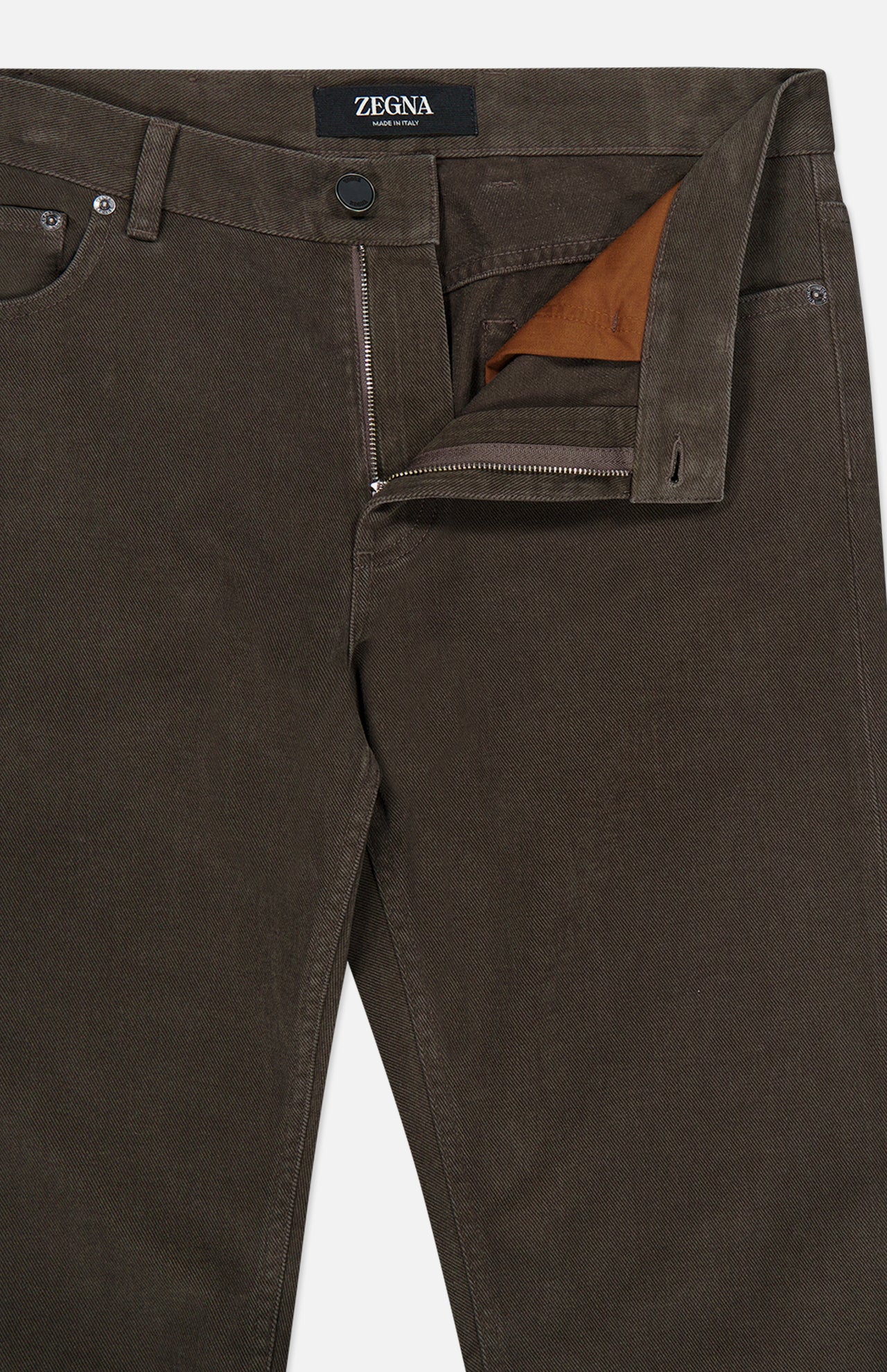 Close-up of brown Pure Cotton Slim Fit Pants by ZEGNA with front zipper and button fly partially open, revealing brown inner lining—ideal for vintage workwear enthusiasts.