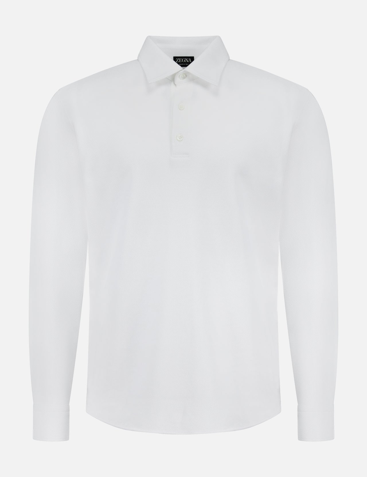 The ZEGNA Pure Cotton Piquet Long Sleeve Polo Shirt features a classic collar and three buttons in white, showcasing Italian craftsmanship and premium quality.