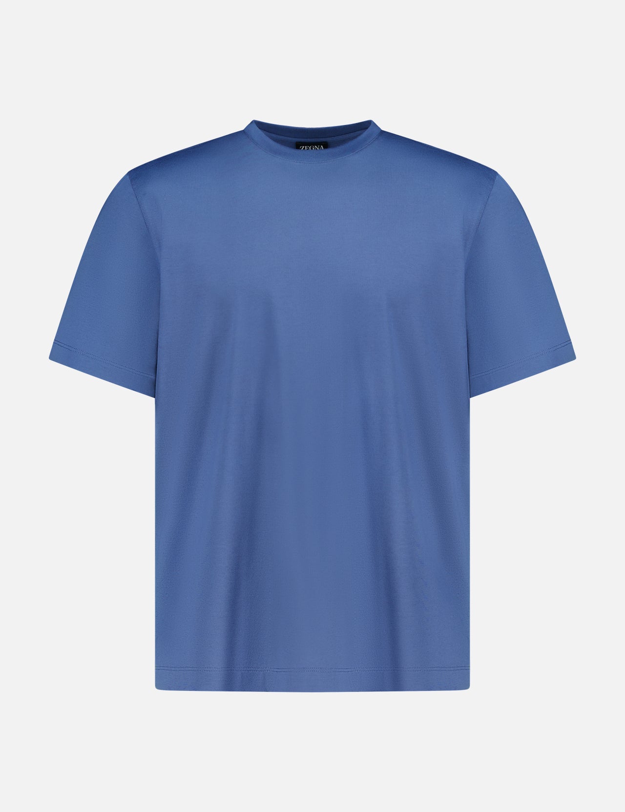 The ZEGNA Pure Cotton T-Shirt is a plain blue, short-sleeved crew neck made from 100% cotton, displayed on a white background.