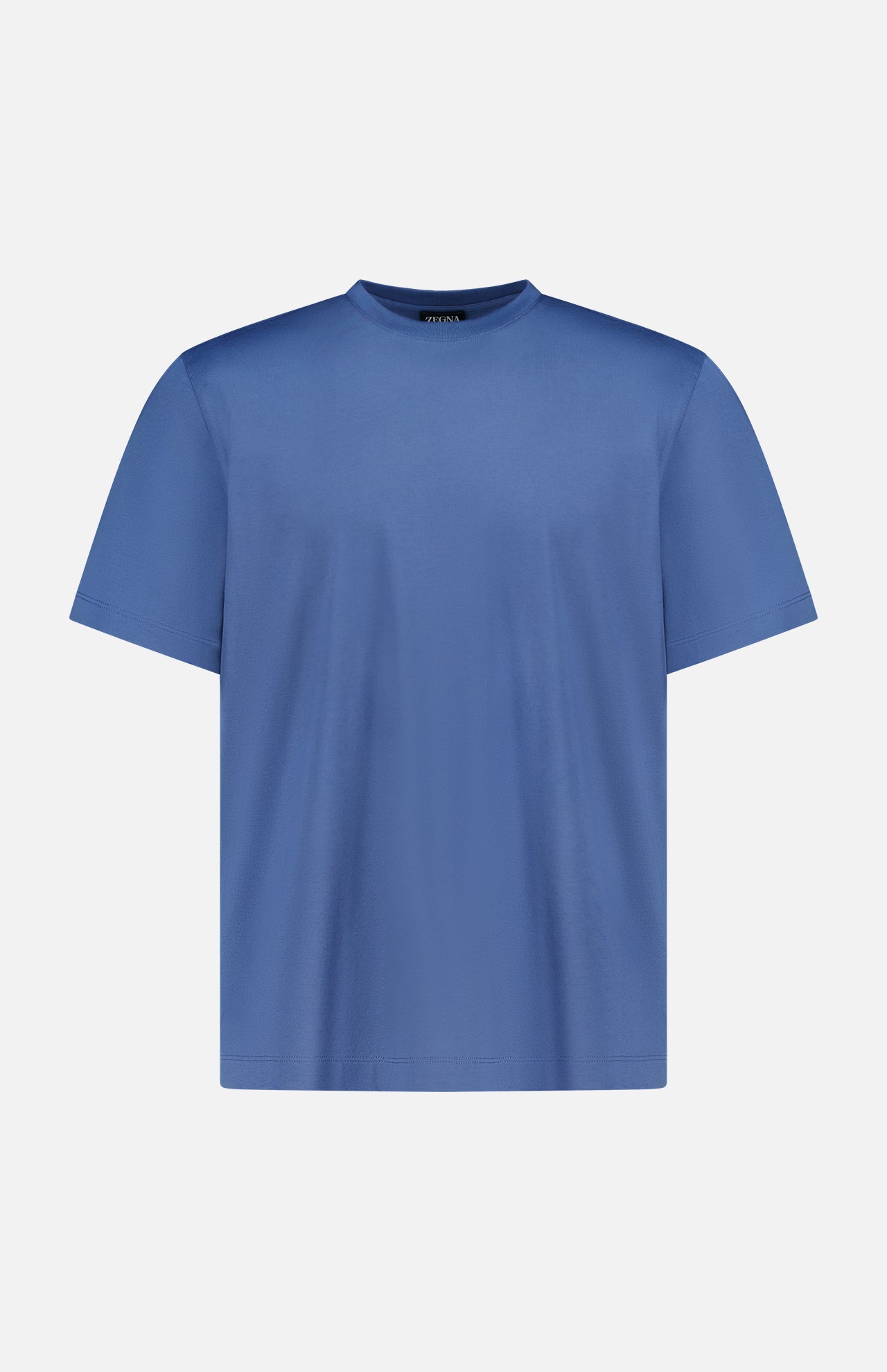 The ZEGNA Pure Cotton T-Shirt is a plain blue, short-sleeved crew neck made from 100% cotton, displayed on a white background.