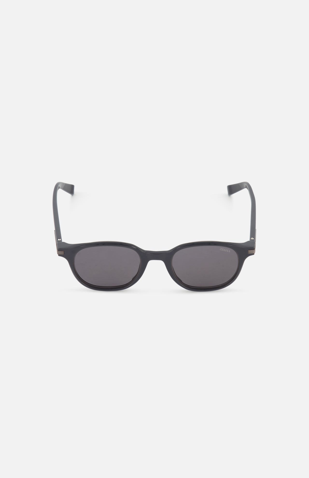 ZEGNA Rounded Square Grey Sunglasses are shown facing forward against a plain white background. Featuring a simple frame and slightly thick, curved arms, these timeless grey sunglasses add effortless style to any look.