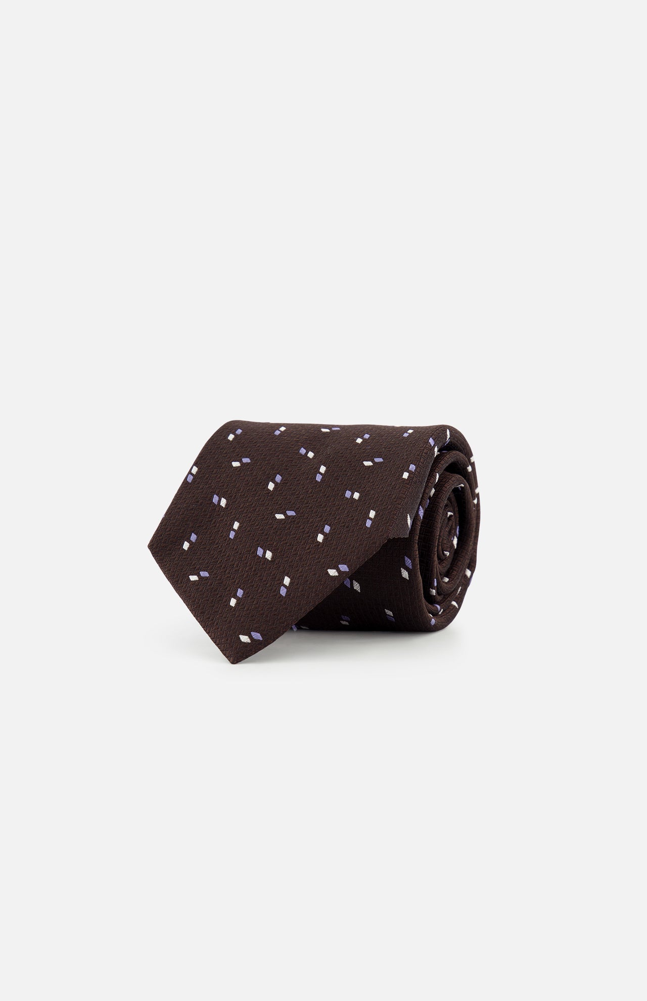 The ZEGNA Silk Jacquard D Neck Tie, made in Italy, features a dark brown color with a subtle pattern of small white and light blue dashes, shown rolled up against a plain white background.
